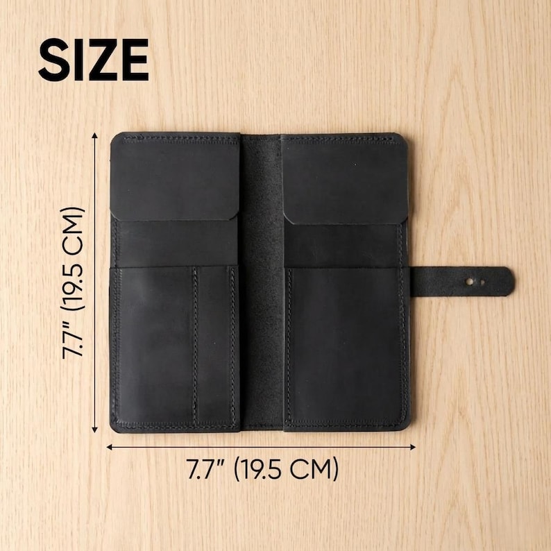 May include: A black leather wallet with multiple interior pockets and a side strap closure. The wallet is open, revealing a structured design with vertical slots. The text SIZE is visible, along with dimensions of 7.7 inches by 7.7 inches.