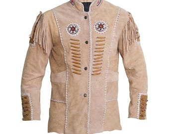 May include: Beige suede jacket with decorative stitching, fringe, and beadwork. Features a mandarin collar, button closure, and two front pockets. The jacket has decorative stitching and wooden beads.