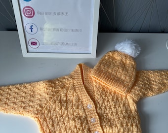 Hand knitted baby cardigan and hat