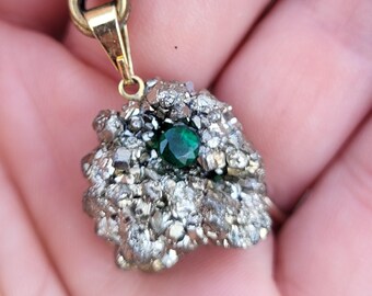 Iron pyrite and cut emerald pendant. Raw pyrite pendant, a unique and original mineral piece.