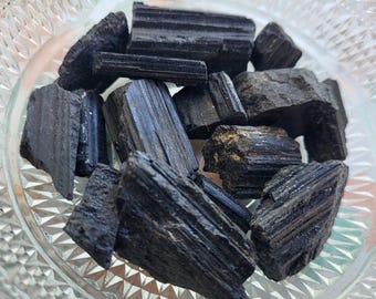 Raw black tourmaline crystals, black tourmaline stone, healing crystals, crystal healing, crystal collection and decoration