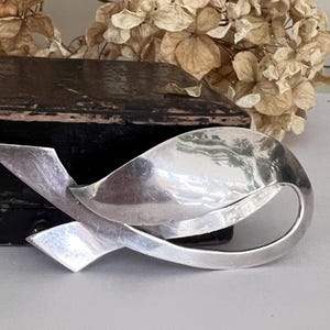 A Vintage Modernist Sterling Silver Sleeping Swan Brooch.