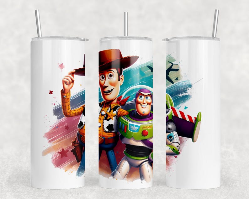 May include: White tumbler with illustrations of Woody and Buzz Lightyear from Toy Story. Woody wears a cowboy hat and Buzz is in a spacesuit. The tumbler has a silver straw and a colourful background.