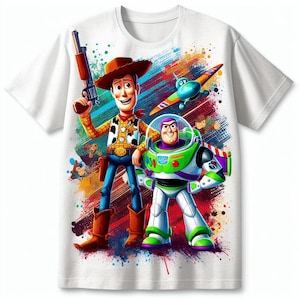 May include: White t-shirt featuring Woody and Buzz Lightyear from Toy Story. Woody is in a cowboy outfit holding a gun, and Buzz is in a spacesuit. The design includes a colourful splatter background and a toy aeroplane.