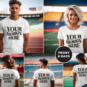 May include: A white t-shirt mockup with the text "YOUR DESIGN HERE" on the front and back. The shirt is being worn by a person in a stadium setting.