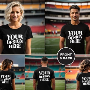 May include: A black t-shirt with the text "YOUR DESIGN HERE" printed in white on the front and back. The t-shirt is being modeled by two people in a stadium setting.