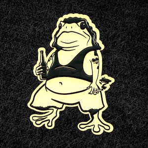 May include: A black and white cartoon illustration of a frog wearing a black tank top and holding a bottle of beer and a cigarette. The frog has a tattoo on its arm that says "MOM".