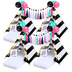 Puede incluir: Cuatro tiendas de campaña tipo tipi a rayas blancas y negras con colchones blancos, decoradas con globos, luces de cadena y almohadas con notas musicales. Una colorida guirnalda de borlas y globos rosas, negros y turquesas completan el tema de la fiesta.