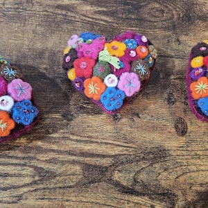 Felt Flowers on heart shaped decoration. Anthropologie and vintage inspired