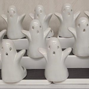 Ghost votive candle holder