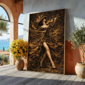 May include: A rectangular wall art print featuring a person in a wide-brimmed hat and a flowing, textured gown of black and gold, playing a violin. The artwork displays a dynamic, swirling pattern of dark and metallic gold paint strokes.