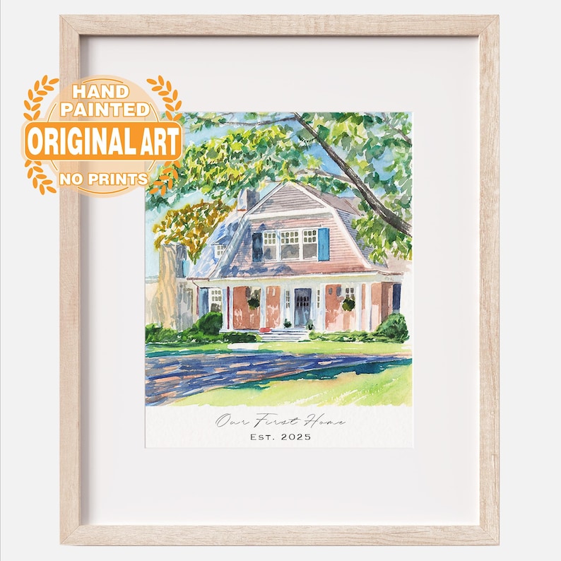 May include: A framed watercolor painting of a house with a gambrel roof, green trees, and a lawn. The text reads "HAND PAINTED ORIGINAL ART NO PRINTS" in an orange circular badge, and "Our First Home EST. 2025" at the bottom of the artwork.