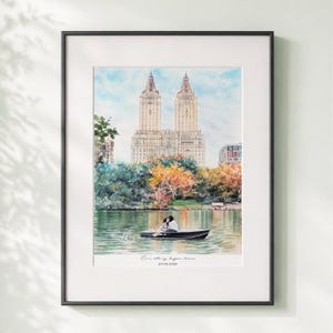 May include: Watercolor painting of a couple in a rowboat on a lake, with a cityscape in the background. The artwork is framed in a black frame. The text "Our story began here" and a date are at the bottom.