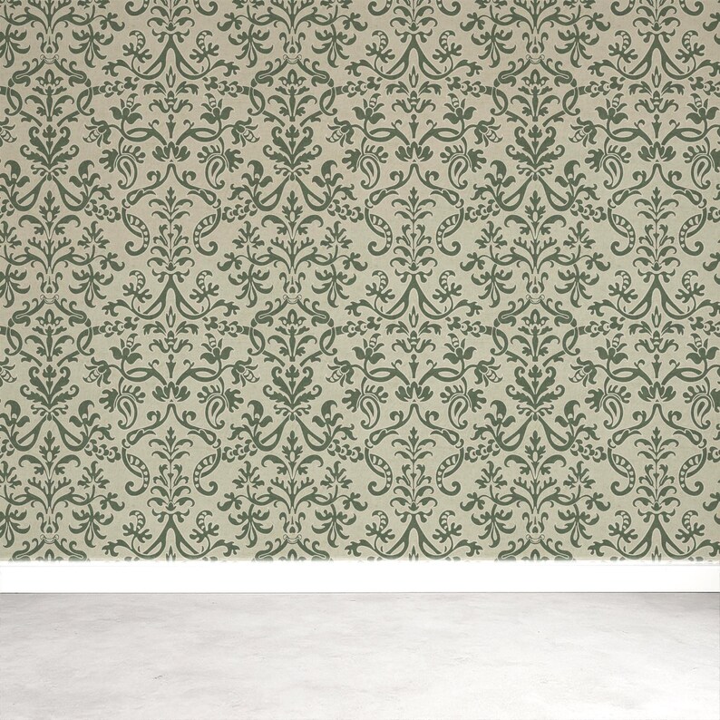 a wall with a repeating pattern of green and brown floral designs, creating a decorative and ornate appearance.
