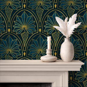 May include: A teal and gold peacock pattern wallpaper forms the backdrop for a white mantel. A white vase holds feathers, and a candle sits in a decorative holder. The wallpaper features a repeating peacock design.
