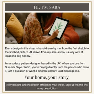 A woman is sitting on a couch, holding a tablet device and drawing a pattern on it.
