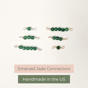 May include: Four different sizes of emerald jade connectors with gold-toned jump rings. The connectors are handmade in the US.