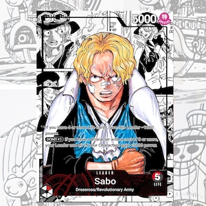 May include: A trading card featuring Sabo from the Dressrosa/Revolutionary Army. The card has a central image of Sabo with blonde hair and a determined expression. Text includes "LEADER Sabo" and game instructions. The card is set against a background of manga-style illustrations.