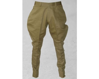 May include: A pair of khaki riding breeches with a belt loop and a zipper fly.