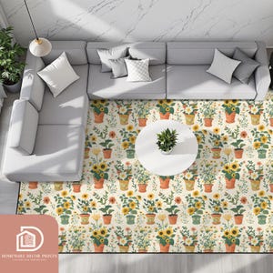 May include: A floral area rug with potted sunflowers and other flowers in terracotta pots. The rug has a cream background and is placed under a grey sectional sofa and a white coffee table. The rug is from Homeware Decor Prints.