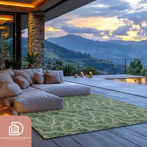 May include: A green and beige patterned area rug with a modern design. The rug is placed on a wooden deck overlooking a mountain range and a swimming pool.
