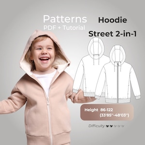 May include: A pink hoodie with a zipper and a hood. The hoodie is designed for children and has a height range of 33.85 inches to 48.03 inches. The pattern includes a PDF and a tutorial.