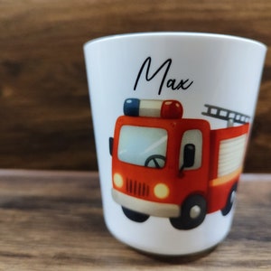 May include: White ceramic mug with a red fire truck illustration and the name "Max" printed on the front.