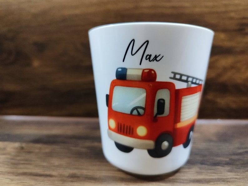 May include: White ceramic mug with a red fire truck illustration and the name "Max" printed on the front.