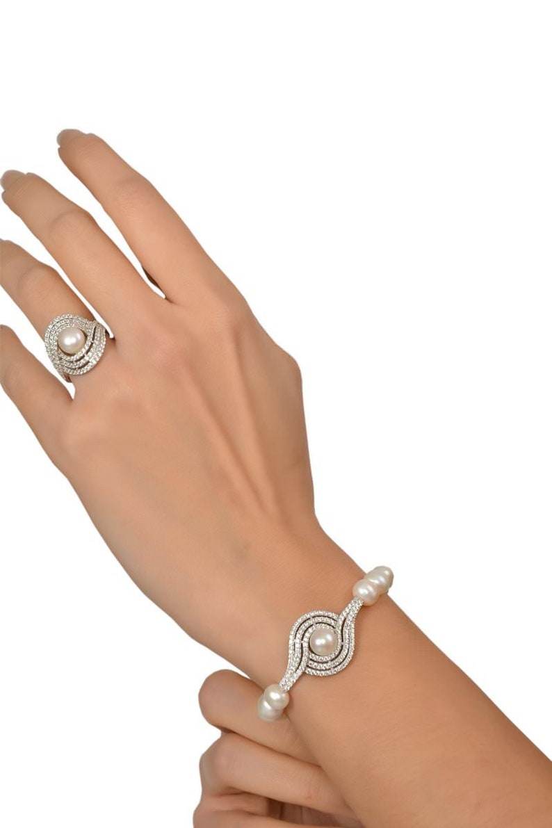 Schmuckset mit Kristallen: 4-teiliges Süsswasserperlen-Set in 925er Silber Perlenkette Perlenarmband Perlenohrringe & Perlenring Bild 6