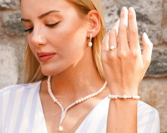 Pearl jewelry set 4 pieces: pearl necklace, pearl bracelet, pearl earrings and pearl ring with rhodium-plated 925 sterling silver. Model MY-S2160