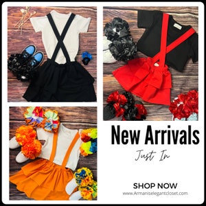 May include: A collage of children's outfits, including white and black t-shirts with suspenders, tiered skirts, and matching accessories. The outfits are in black, red, and orange. The text "New Arrivals" and "Just In" is displayed.
