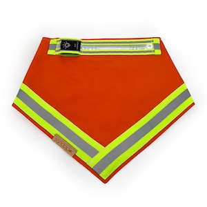 May include: Orange safety bandana with reflective trim and a small light attachment. The bandana has the word "SONOCO" printed on it.