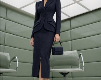 May include: A dark navy blue pinstriped suit consisting of a tailored blazer with structured shoulders, a notched lapel, and three buttons, paired with a matching midi-length skirt featuring a front slit, and a small matching top-handle handbag.