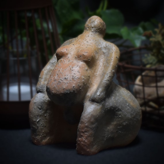 Handmade traditional Venus figurine made of clay – symbol of pregnancy and desire for children