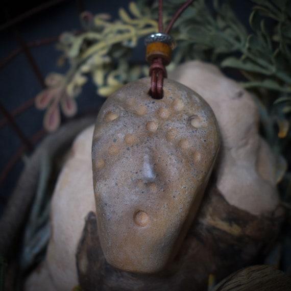 Handmade amulet talisman - ethnic mask - made of traditionally fired clay with leather or cotton strap
