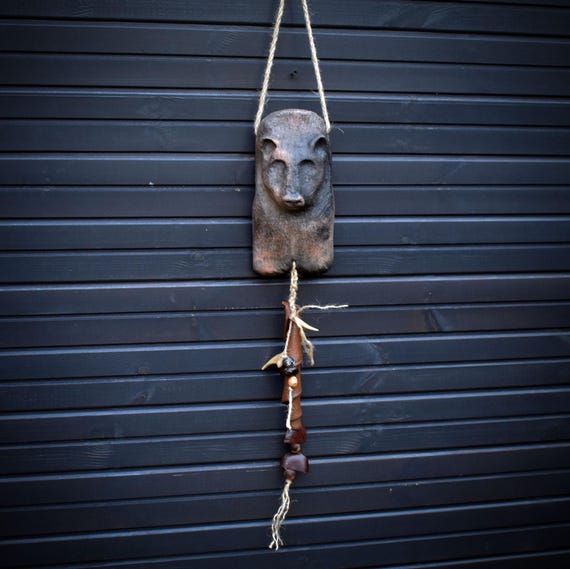 Archaic wall decoration bear – smoke-fired art with bone, seeds and wood - Item No.: HEX029