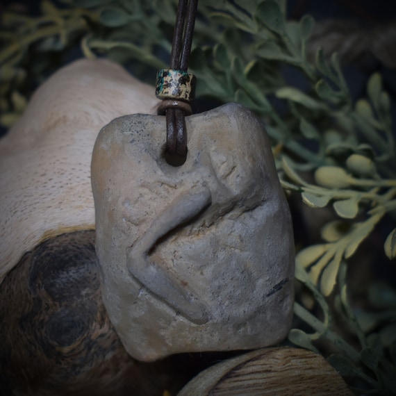 Handmade Futhark Rune Kenaz amulet made of traditional fired clay - Adjustable leather strap with pearl - Unique jewelry