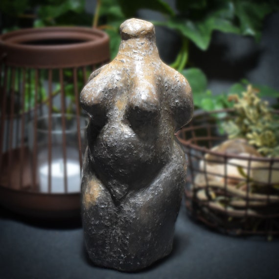Pagan Wicca made of clay in smoke fire refined fertility goddess symbol of the matriarchy, stylish room decoration, spiritual gift
