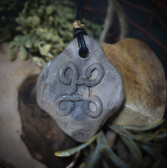 Unique handmade amulet with Celtic braid pattern made of traditionally fired clay - your personal lucky charm