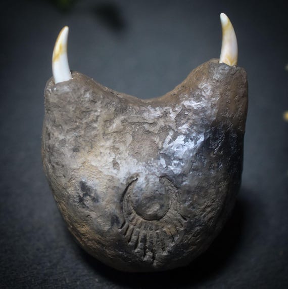 Ascension of the Soul – Shamanic Rattle with Tusks and the Symbol - The Rising Woman - Clay Sounding Body - Item No.: SRA044