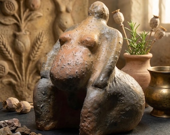 Handmade traditional Venus figurine made of clay – symbol of pregnancy and the desire for children