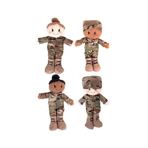May include: Four plush toy dolls dressed in military uniforms. The dolls are wearing camouflage uniforms with different branch insignia. The dolls are all smiling and have brown hair.