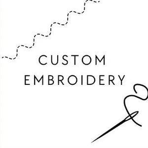 May include: A white graphic featuring the black text CUSTOM EMBROIDERY centered in the middle. Above the text is a black wavy dashed line, and below the text to the right is a black line drawing of a sewing needle with a thread loop.