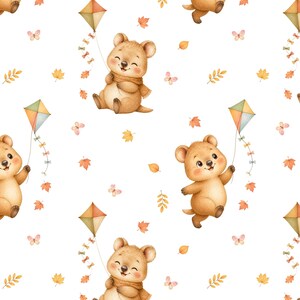 May include: A repeating pattern featuring light brown quokkas with smiling expressions, some wearing scarves, holding colourful kites with long tails. The design includes scattered orange and yellow autumn leaves, small butterflies, and sprigs of foliage.