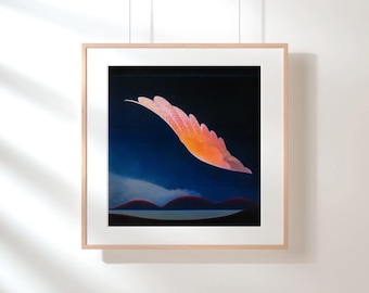 May include: A square framed wall art piece featuring a dark blue night sky with a single, glowing orange and pink feather-like shape floating above a horizon line of dark, rounded hills and a calm, reflective body of water below.