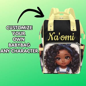 May include: Black and yellow baby bag with the name "Na'omi" in yellow script. The bag features a cartoon illustration of a girl with curly black hair and a blue headband. The text "CUSTOMIZE YOUR OWN BABYBAG ANY CHARACTER" is on the left.