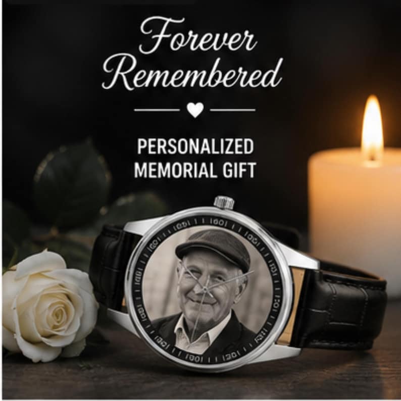 May include: A silver wristwatch with a black leather strap featuring a custom black and white portrait of a person wearing a flat cap on the watch face. The text Forever Remembered and PERSONALIZED MEMORIAL GIFT appears above the watch.