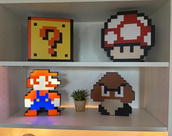 Zestaw 4 lamp z grafiką pikselową Super Mario – Mystery Block, Mushroom, Mario, Goomba – wystrój dla geeków gier retro