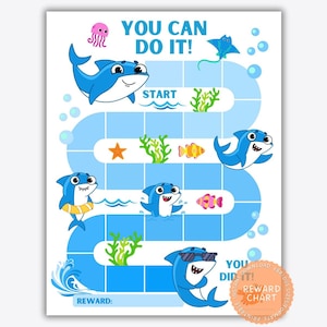 May include: A reward chart featuring a blue winding path with the text YOU CAN DO IT! at the top and YOU DID IT! at the bottom. The chart includes illustrations of blue sharks, a pink jellyfish, a stingray, starfish, fish, and green seaweed.