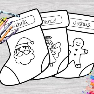 May include: Three blank Christmas stockings with names "Isabella", "Michael", and "Joshua" written on them. Each stocking has a different image to color: Santa Claus, an angel, and a gingerbread man.